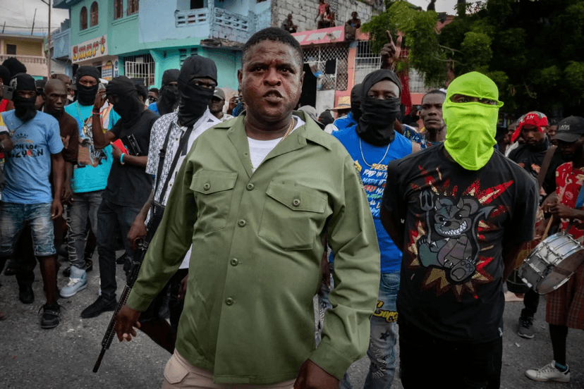 File photograph of Haitian gang leader Jimmy ‘Barbecue’ Cherizier with a group of men.